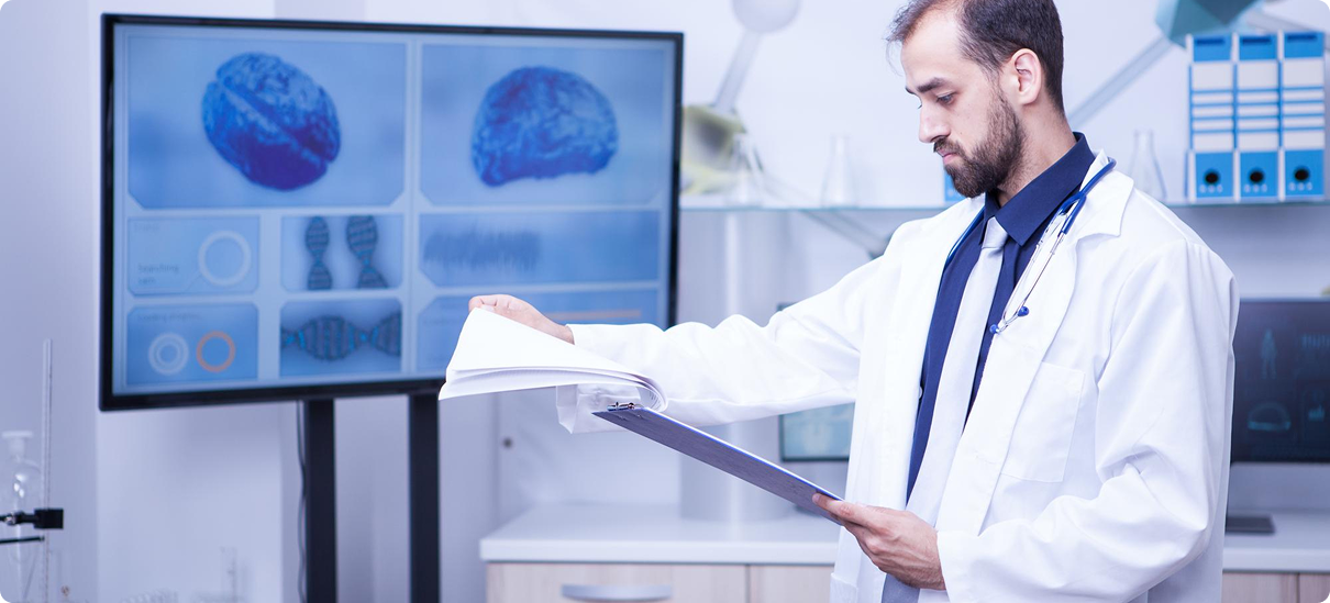 Doctor reviewing brain imaging for TMS therapy planning at TMS Revitalizes clinic in Missoula